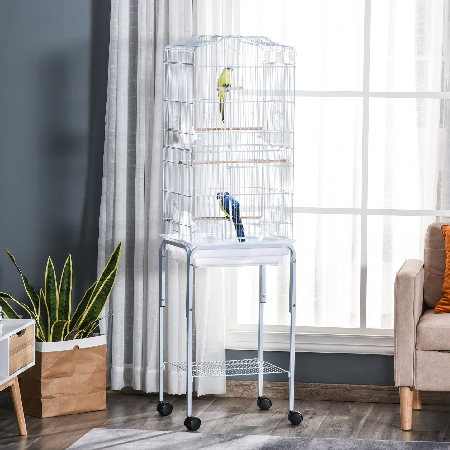 Cage à oiseaux sur roulettes avec tablette de rangement