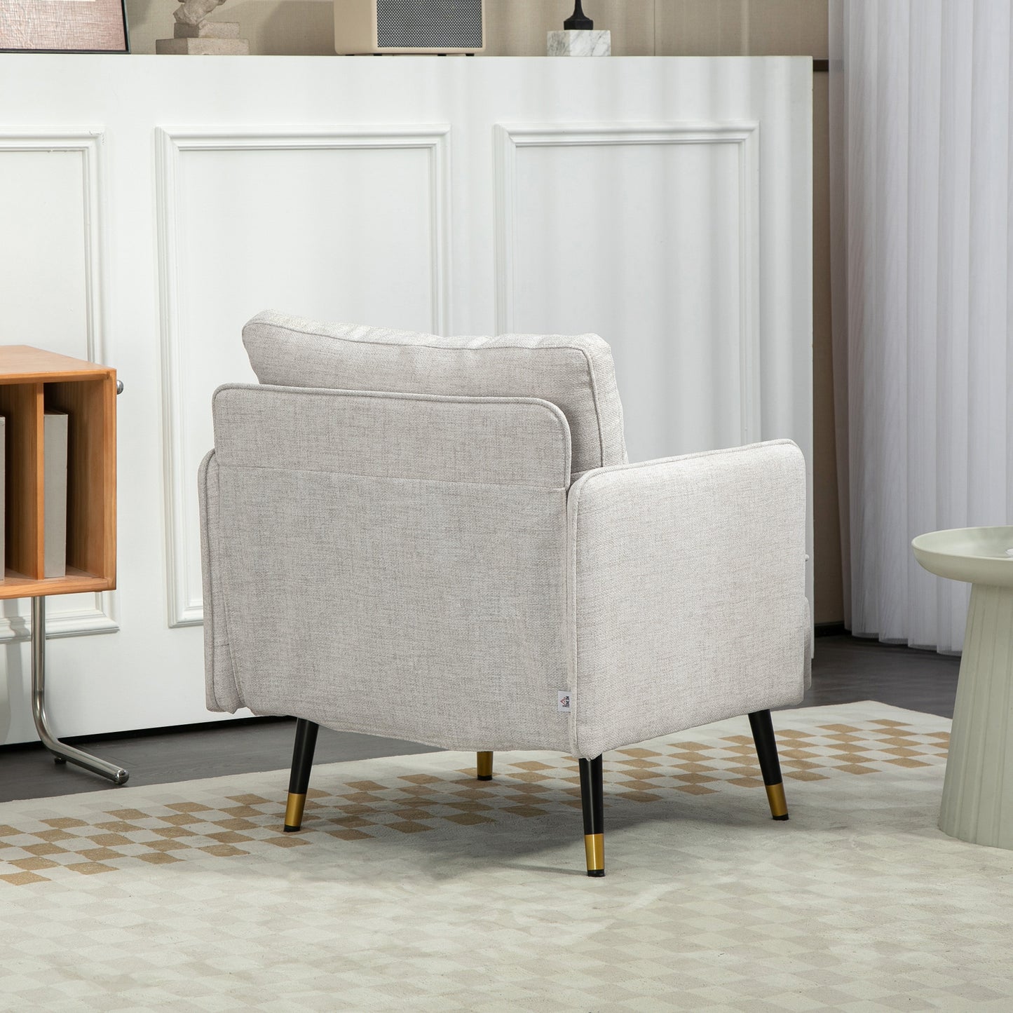 Fauteuil d'accent rembourré dossier capitonné pieds acier