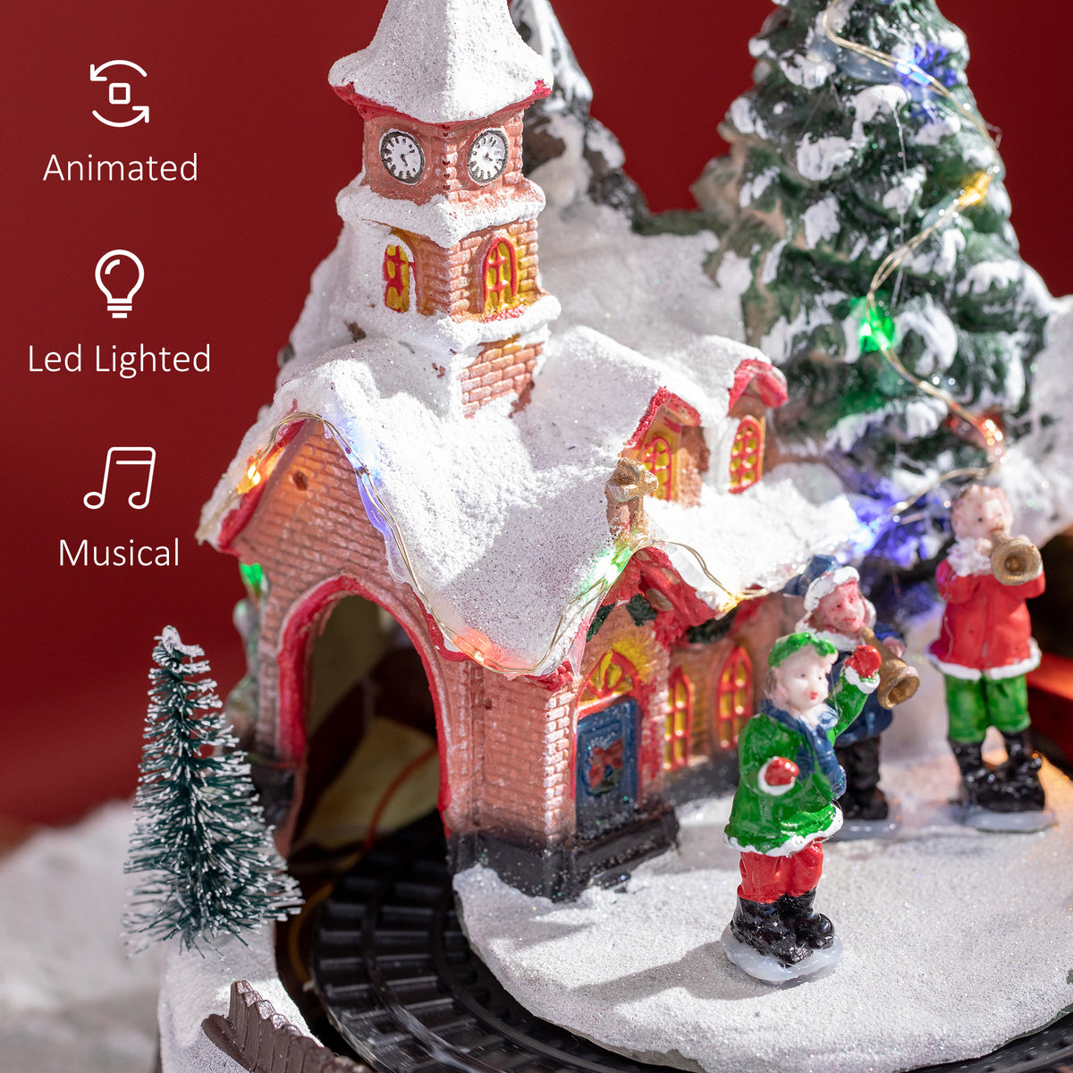 Décoration de village de Noël avec train rotatif et musique